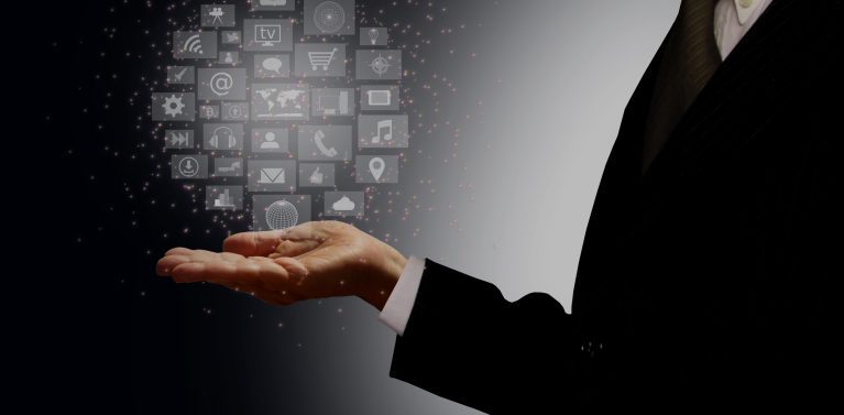 image of a man in a tuxedo holding his hand out with floating icons over his palm.