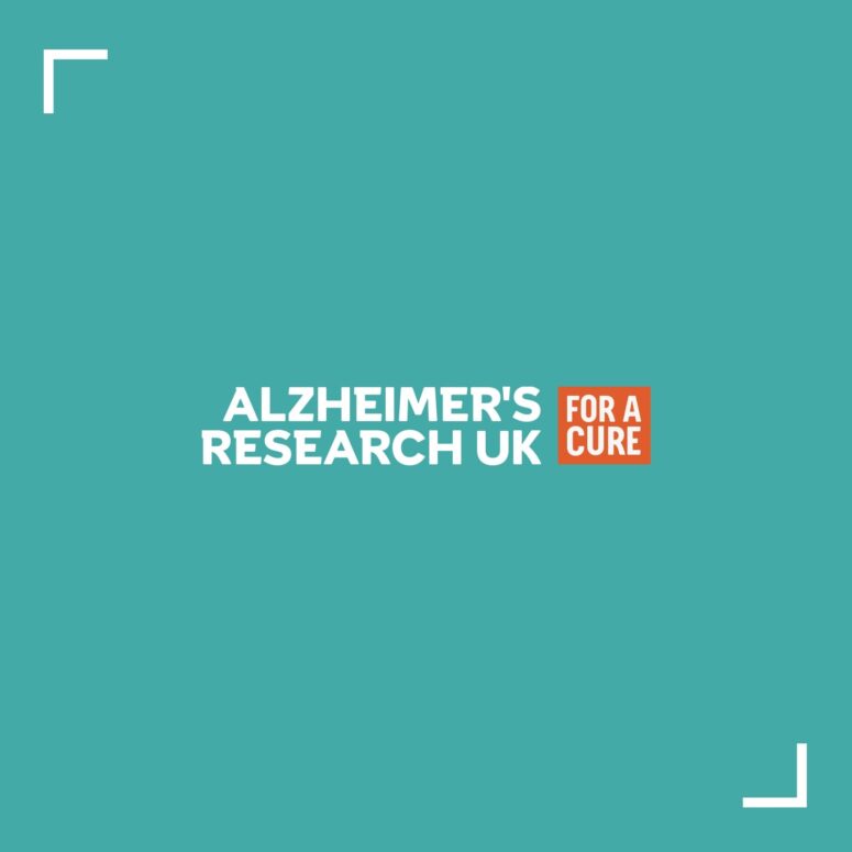 Alzheimers Research website image of a teal coloured box with the wording 'Alzheimers Research UK' and 'For a Cure' to left of the wording in a small orange box