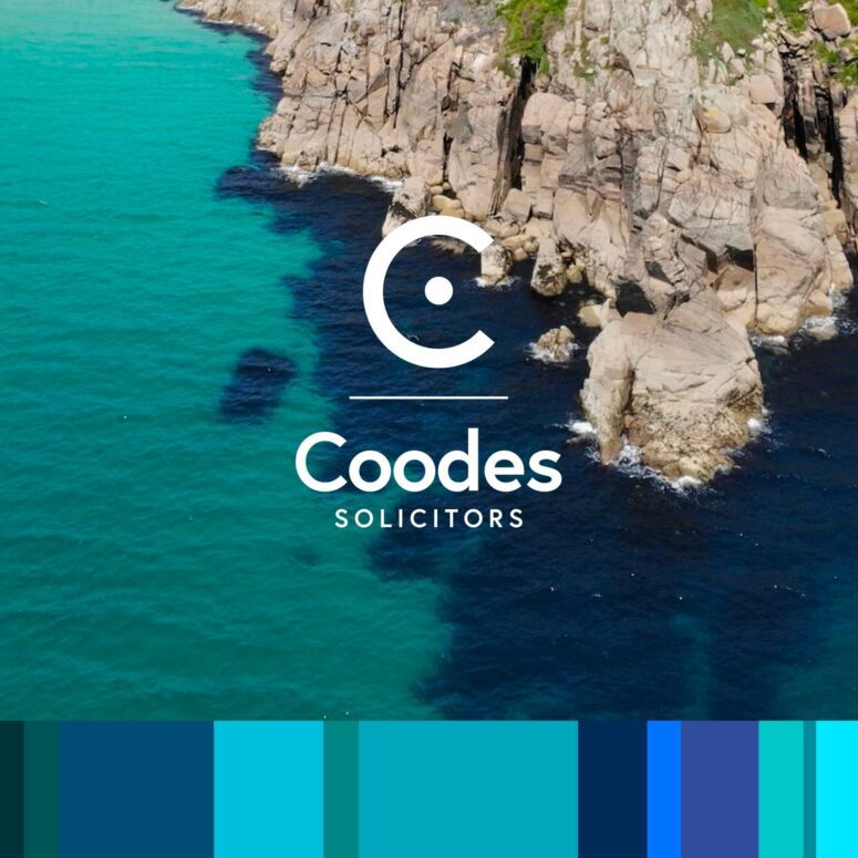 This image shows the logo and text of Coodes Solicitors, a law firm, in white. The website image features a scenic coastal background with turquoise water.