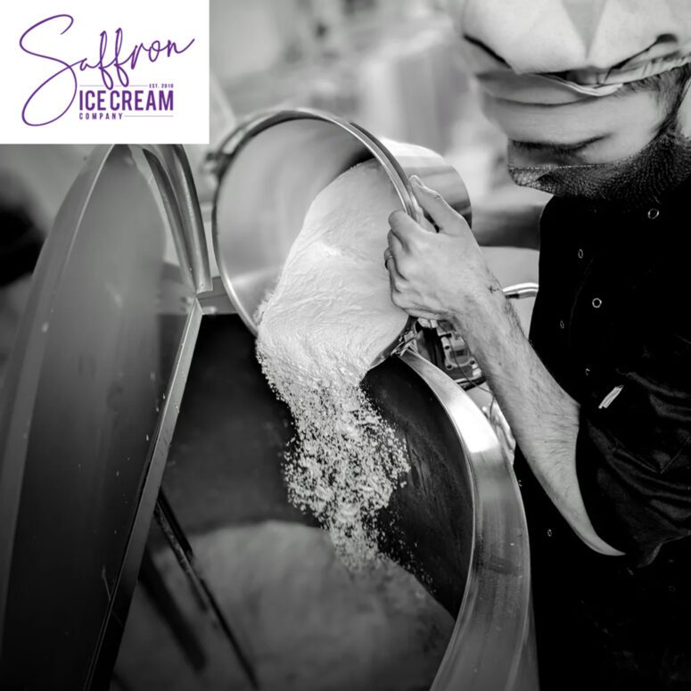 Saffron Walden Ice Cream logo on a phot of a man using machinery to make ice cream