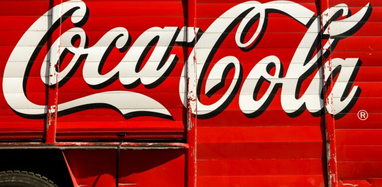 image of the coka-cola logo on the side of a van