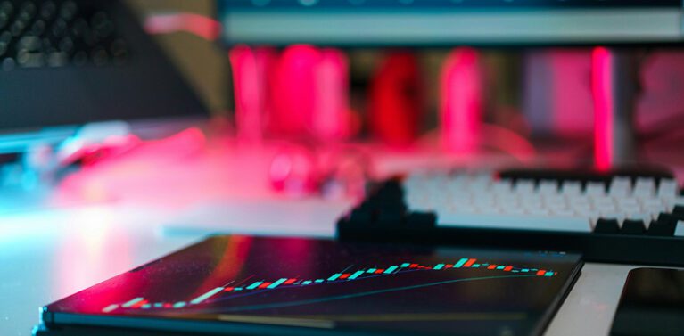 image of a graph on an ipad with a pc in view.